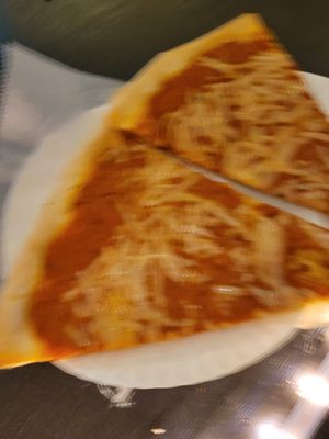 Blurry picture of vegan vodka sauce pizza slices at Vinnie's Pizzeria in Brooklyn