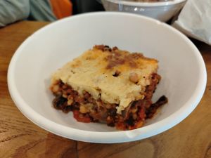 Shepherd's pie, stratificazione di zucchine, melanzane e Volognese, coperto da purè di Calizzano. at RAMEKIN Gastronomia Naturale in Finale Ligure