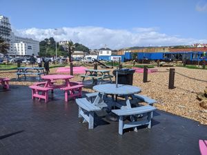 Seating by the crazy golf at Hulas Beach Shack in Folkestone