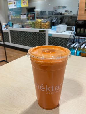 The Buzz (carrot, green apple, orange, lemon & ginger). at Nekter Juice Bar in Edina