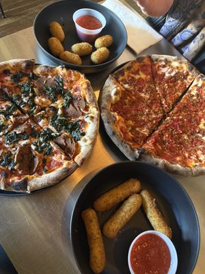 Florentine on the left, jalapeño poppers, Fra Diavolo, and the mozzarella sticks   at DeFazio's Pizzeria in Albany