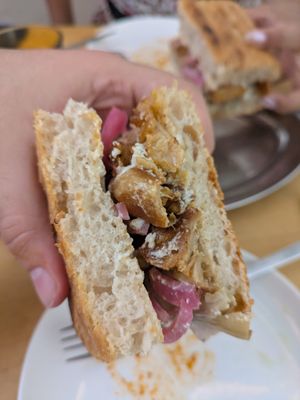 Truffle focaccia with cashew cheese, grilled artichokes and pickled onion at Grasa in Barcelona