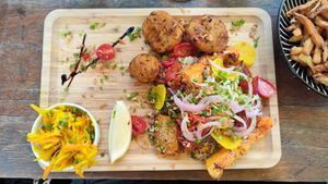 Assiette vegan, accompagnée d'un bol de frites. at Kivala in Saint-paul