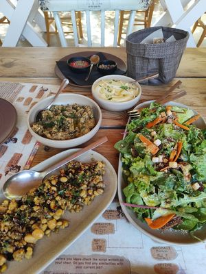 Minoan salad (left) and Citrus Salad (right). Smoked eggplant and fava spread in the middle at Pasiphae Restaurant in Crete