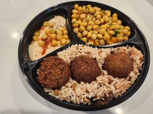 Falafel plate (falafels, chickpea salad, hummus, rice with lentils) at Dimassi's Mediterranean Buffet in Allen