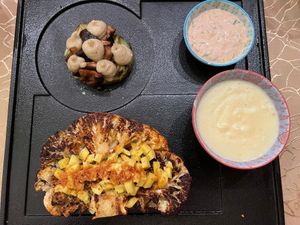 Bumba Cauliflower Steak marinated in spice blend w/
Sarawak black peppercorn, crushed dried curry leaf, stuffed
with charred red bell pepper w/spices, &  avocado mushroom terrine at Manja in Kuala Lumpur
