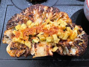 Bumba Cauliflower Steak marinated in spice blend w/
Sarawak black peppercorn, crushed dried curry leaf, stuffed
with charred red bell pepper w/spices, &  avocado mushroom terrine at Manja in Kuala Lumpur