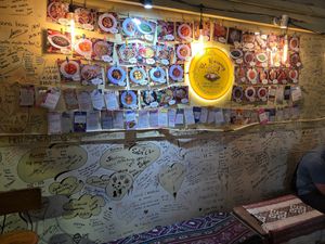 wall of reviews at De Waroeng Labuan Bajo in 