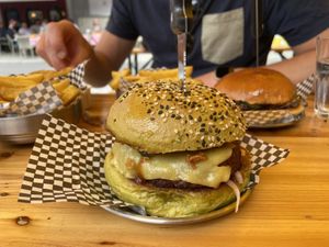 The vegan black Betty burger with vegan cheddar, bbq sauce, signature burger sauce, fried onions,  pickle, and red onion. Very tasty and filling!  at Dr Feelgood's Burgers in Eindhoven