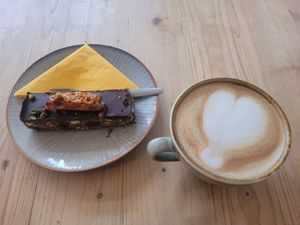 Vegan Honeycomb, Pistachio + Cranberry Tiffin and Oat Latte at Becws Melyn in Llanberis