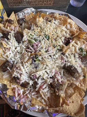 Vegan nachos with what I think was crumbled up black bean patties. Can’t show the topping because they served it with sour cream.   at Stray Dog in Minneapolis