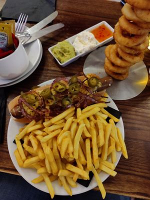 Vegan hotdog and onion rings at The Auld Hoose in Edinburgh