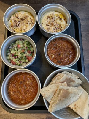 Hummus, salsa alle melanzane, pita e insalata di verdure persiana   at Patog in North West London