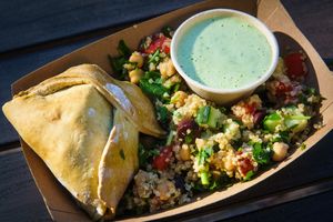 The School Resource Officer: Tabouleh, Tzatziki and one golden Fatayer (Similar to a Spinach Empanada) at Well-Fed Ed - Food Truck in Wilmington