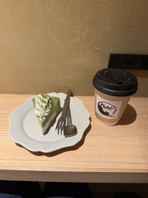 Matcha and white chocolate slice, hot chocolate.   at Naki - vegan sweets in Osaka