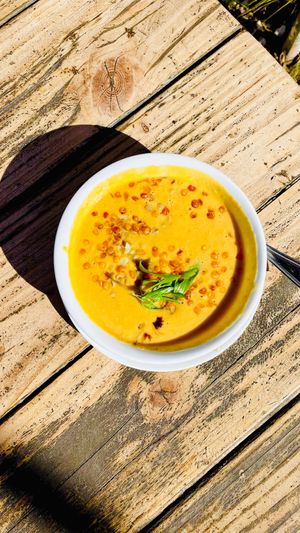 Creamy Corn Chowder with cauliflower and cashews, garnished with crispy lentils and green onions at Seabirds Kitchen - The LAB in Costa Mesa