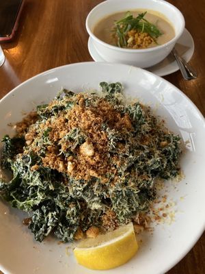 Corn chowder in the back and half size kale Caesar salad which was still huge!   at Seabirds Kitchen - The LAB in Costa Mesa