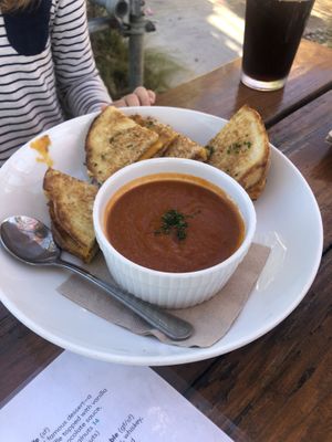 Grilled cheese and tomato soup with root beer Olipop  at Seabirds Kitchen - The LAB in Costa Mesa