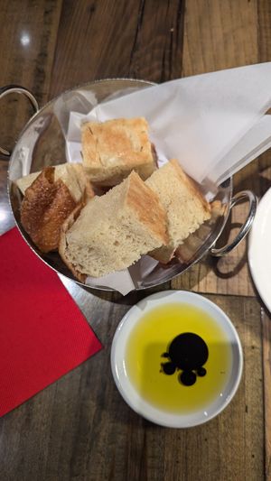 Complimentary focaccia bread appetizer with olive oil at  Testa Barra Kitchen & Cocktails in Macomb Township