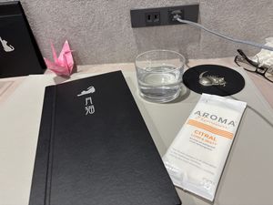 Handy outlet, big towel and a paper crane.  at Vegan Cafe Tsukineko in Osaka