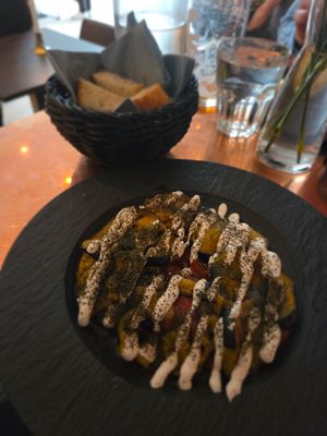 Fried aubergine and tomato with vegan garlic sauce and foccaccia at Bread and Wine in Tromsoe