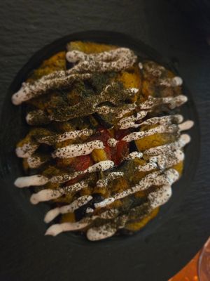 Fried aubergine and tomato with vegan garlic sauce at Bread and Wine in Tromsoe