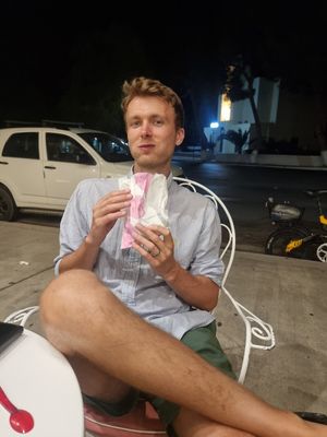 Hubby enjoying his bag of chocolate at Repapis - Ζαχαροπλαστείο in Leros