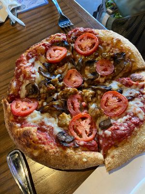 Vegan cheese, tempeh, roma tomatoes, carmalized onions, mushrooms   at Mellow Mushroom in Lincoln