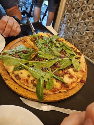 Potato cheese, vegan bolognese, rocket, olives at Los NoNos in Rio De Janeiro