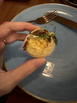 I can’t remember what it was called but was crunchy with potato and vegan yogurt. It’s on the street food menu. Absolutely fantastic   at Namaste Village - Oxford in Oxford