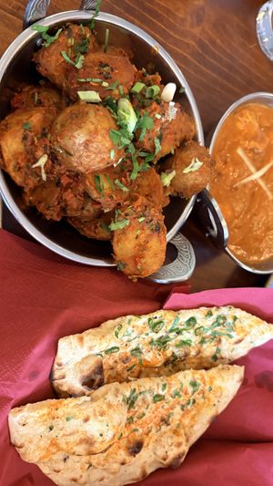 Bombay aloo and chilli garlic naan  at Namaste Village - Oxford in Oxford