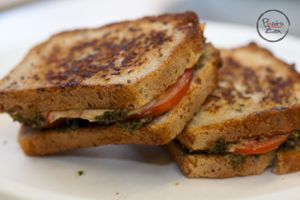 Arugula Pesto Grilled Cheez          
Cashew based  Probiotic 'Cheese' melted with Arugula Basil Pesto and tomato on Gluten-Free Bread. at Electric Blue Elephant - Food Truck in Reno