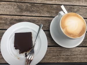 chocolate caramel bar with oat milk cappuccino  at Goodies Berlin - Schlachtensee in Berlin
