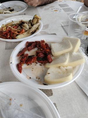 Pomodorini secchi sott'olio (con, unico ingrediente non vegano del pranzo, pecorino fresco) at L'orto del Saraceno in Syracuse