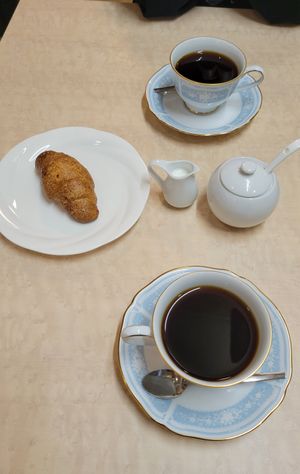 Coffee with soy cream and salty croissant-style viennoiserie at MERCY Vegan Factory - Kyoto Station in Kyoto