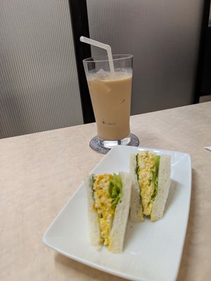 Half an egg sandwich with a milk tea at MERCY Vegan Factory - Kyoto Station in Kyoto