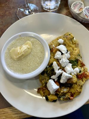 Greek scramble and grits with vegan butterr  at Honey & Co  in Salem