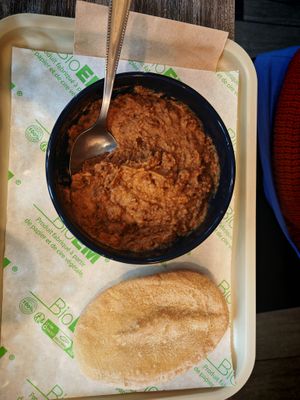 Creamy foul, Preparation based on whole beans, tomato medames, onions, lemon and spices at Veganil in Paris