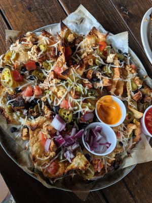 We love Asheville Brewing company! Pictured is our daddy nachos with tofu and vegan cheese at Asheville Pizza and Brewing in Asheville