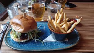 Burger with fries at Rogue Kitchen & Wetbar in Vancouver
