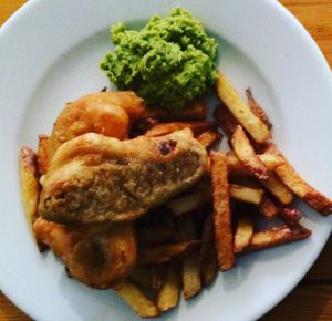 battered vegan sausage, chips and mushy peas at Mono in Glasgow