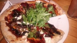 Pizza with garlic mushrooms, cream cheese, capers, and spinach at Mono in Glasgow