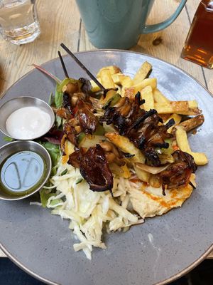 Oyster mushroom skewers with chips, hummus & slaw  at Mono in Glasgow