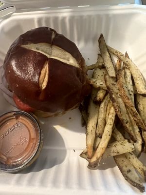 Beyond Burger, Vevan pepper jack cheese, coconut bacon bits, buffalo sauce, buttermilk ranch, lettuce, tomato, onion on a pretzel bun + herb garlic fries + creamy smoky ketchup  at The Red Fern in Rochester