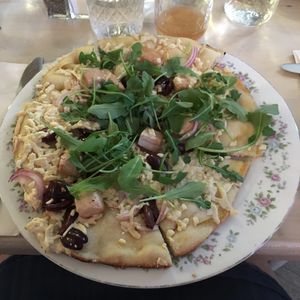 Flatbread special- Daiya cheese, kalamata olives, vegan tofu feta, red onion, arugula at The Red Fern in Rochester
