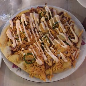 Flatbread special - BBQ sauce, vegan cheddar cheese, vegan ham, pineapple, pickled radish, pickled jalapeños with spicy vegan sour cream at The Red Fern in Rochester