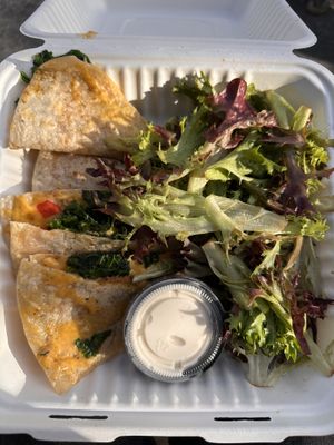 Quesadilla with sour cream and side salad   at The Red Fern in Rochester