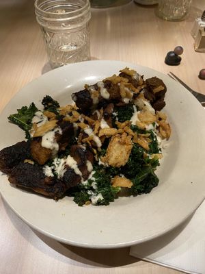 Steak, mashed potatoes, greens, fried onions,with a horseradish drizzle. Awesome!! at The Red Fern in Rochester