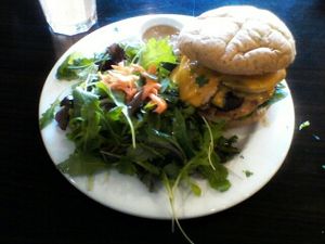ORGANIC CHICKEN BURGER with baby greens side salad. at Green Corner Cafe in Glendale