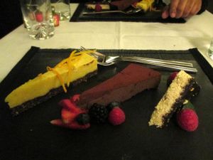 Orange-mango raw cheescake, chocolate/coconut raw cake, and chocolate-coated sesame 'halwa' cake -- dessert for New Year's Eve set menue at Raw - La Suite West in West London